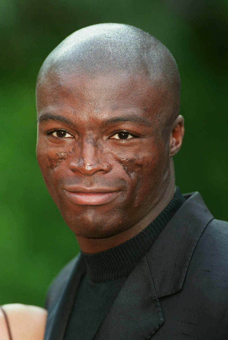 A closeup of musician Seal and his visible facial marks.